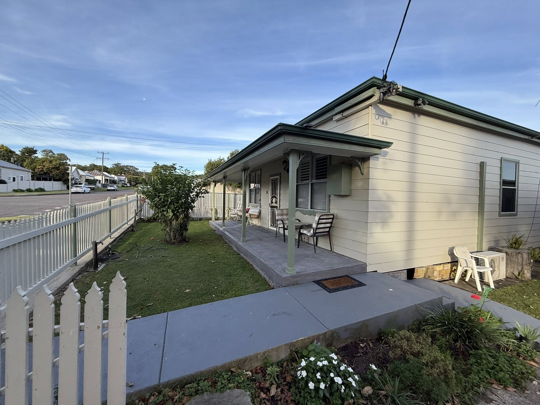 Freshly painted weatherboard cottage with verandah in the Maitland area by Hughesys Painting