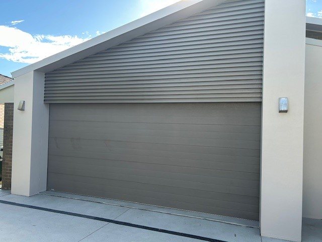 Exterior render and garage door repainted by Hughesys Painting Edgeworth, customer review photo