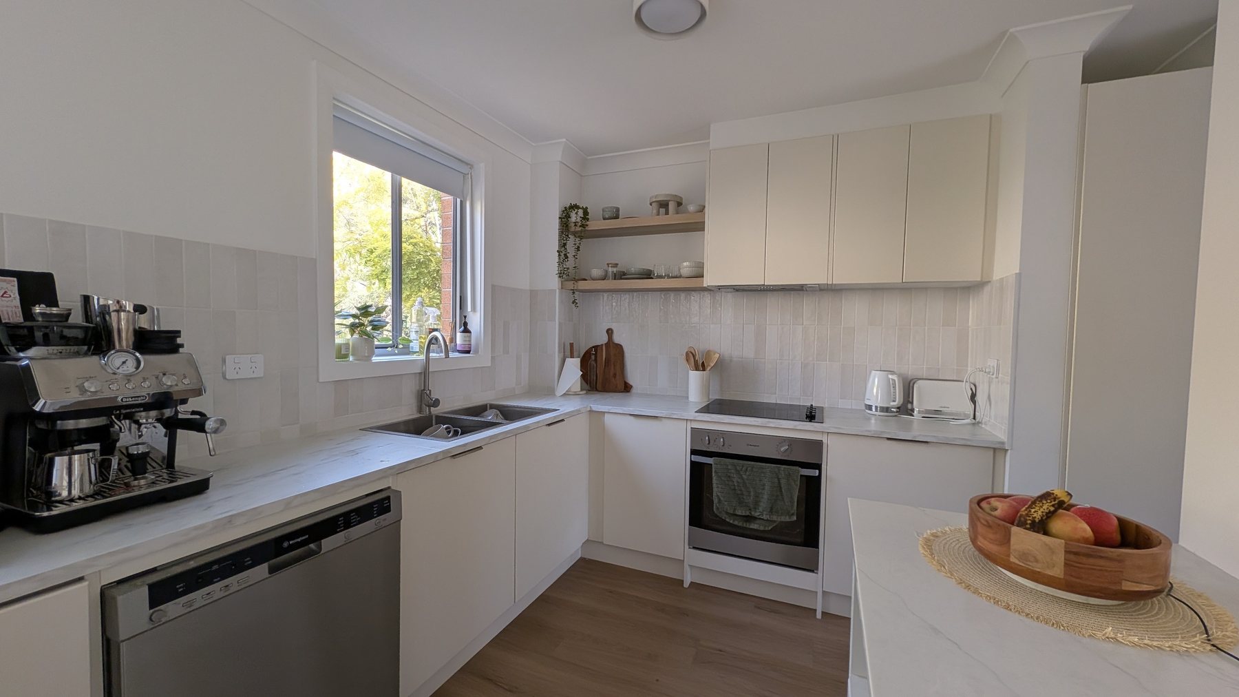 White kitchen freshly repainted by Hughesys Painting during a Newcastle renovation