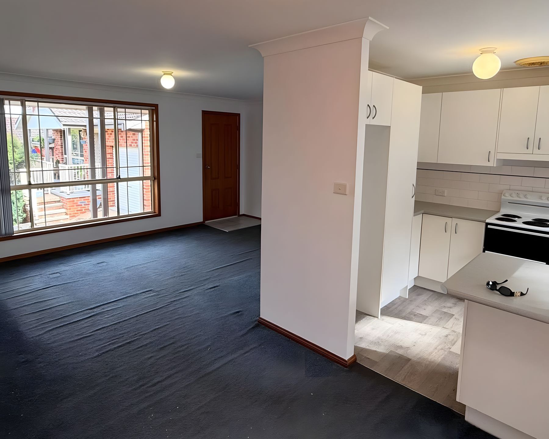 Unit living area and kitchen after an interior repaint