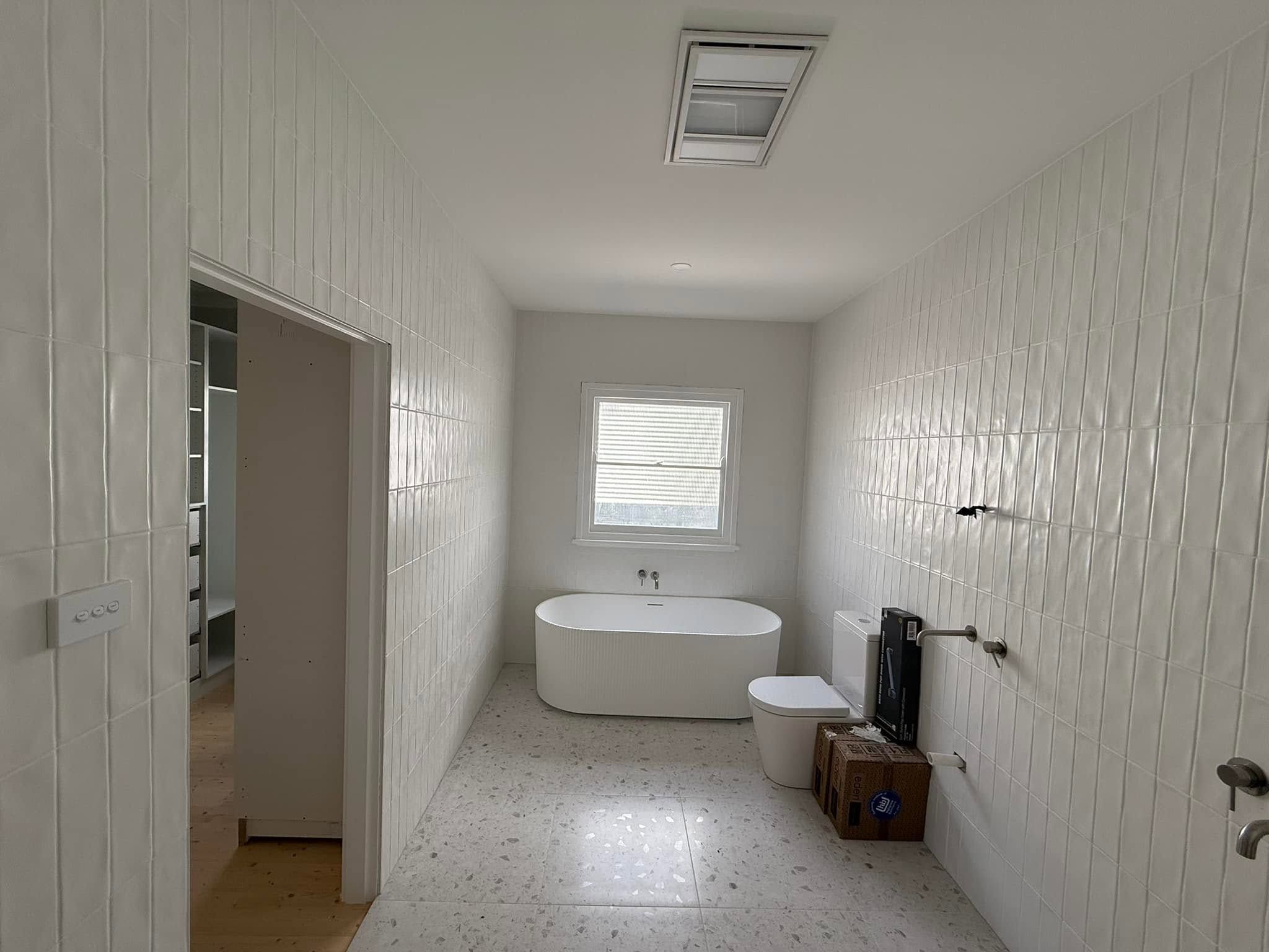 Bathroom with a freestanding bath after painting