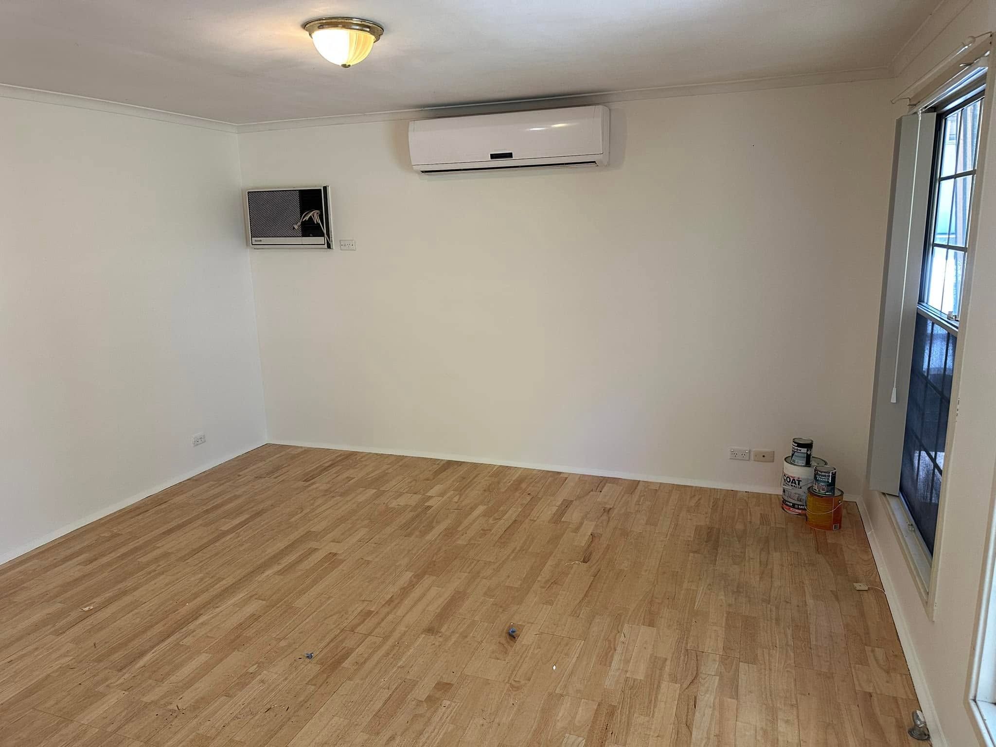 Room with timber floors and freshly painted walls