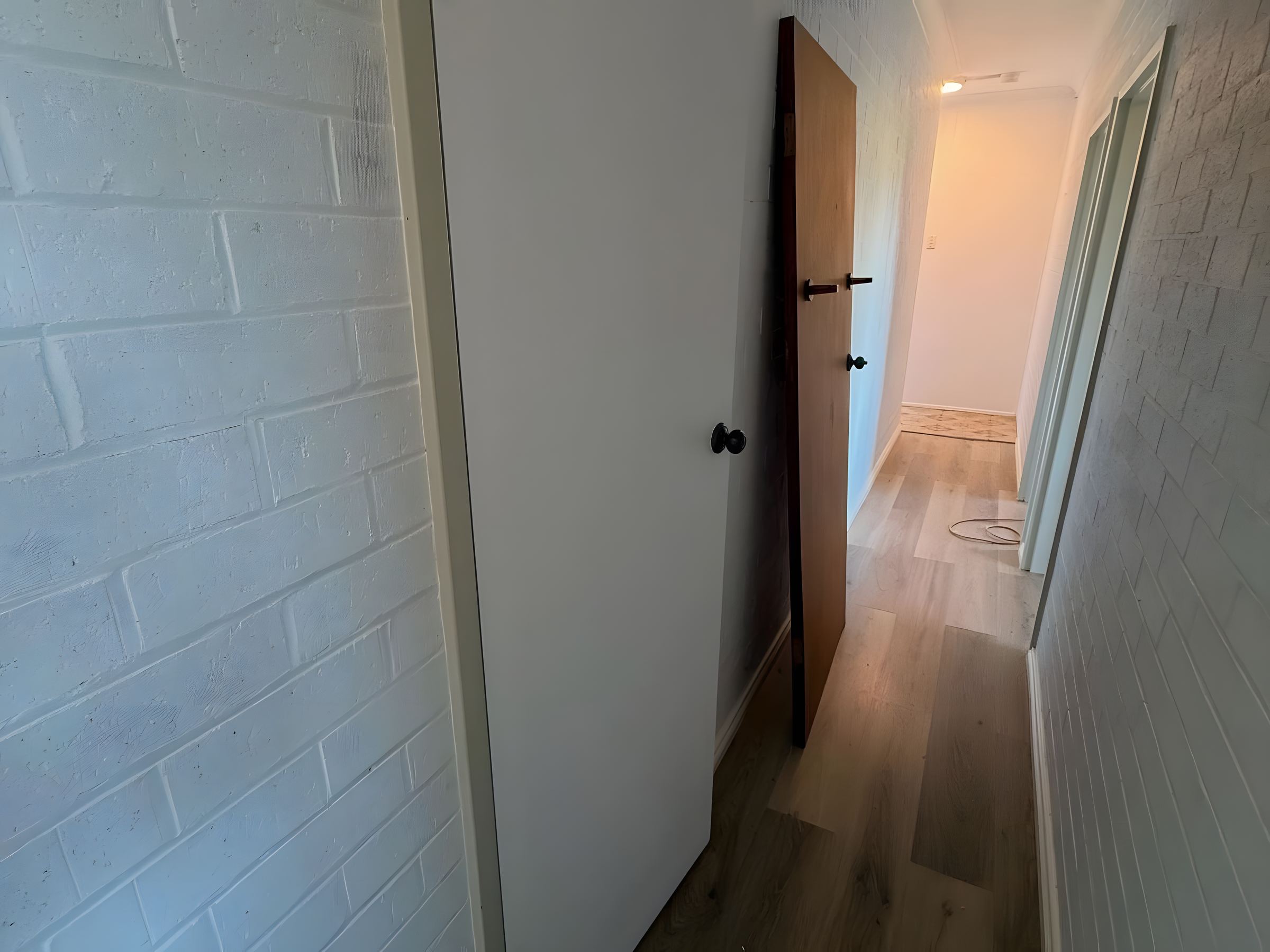 Hallway with painted brick walls
