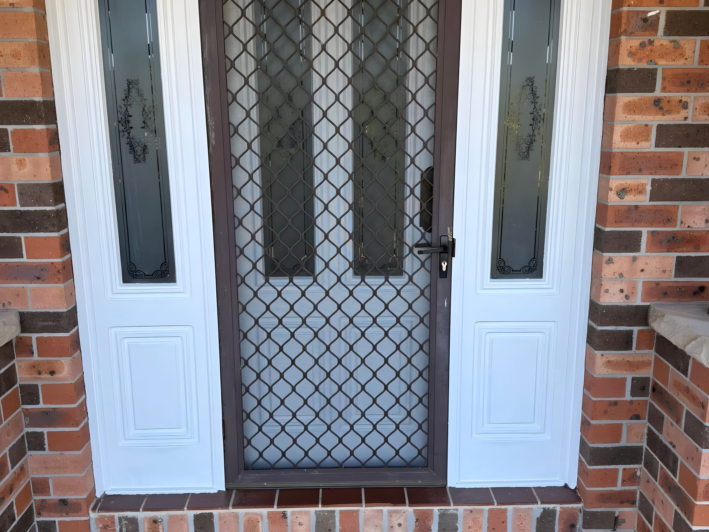 Painted front door set in a brick wall