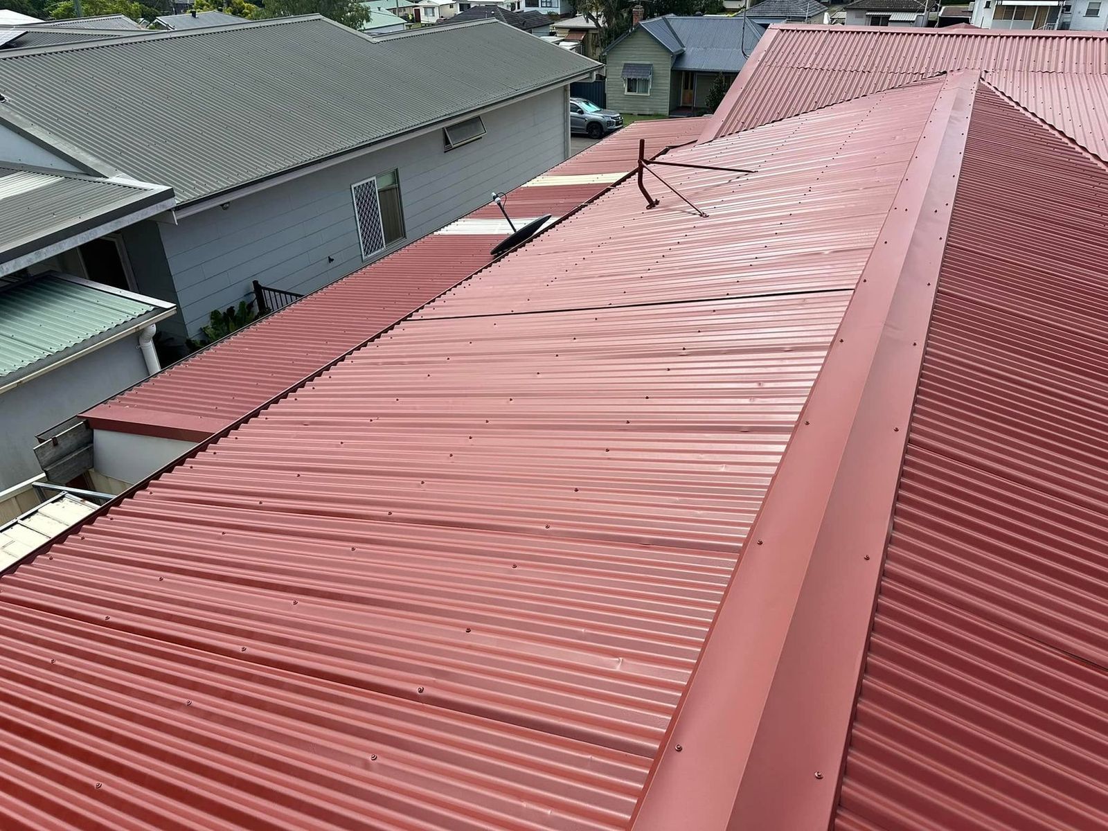Completed Colorbond roof respray in Manner Red by Hughesys Painting Newcastle